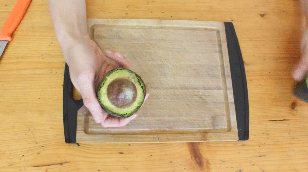 Holding an avocado cut from center